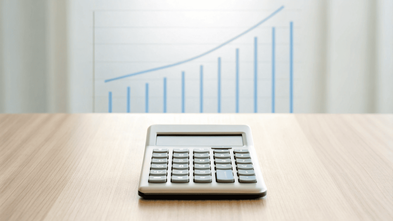 A calculator and a graph showing cost decreasing as volume increases