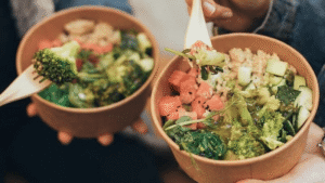 Brown paper bowls with wooden spoon