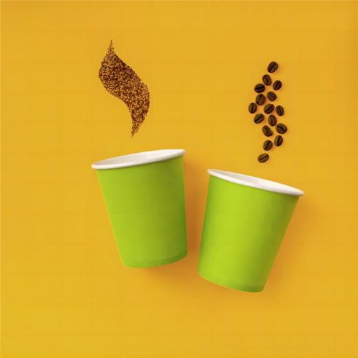 Coffee cup with lid on table