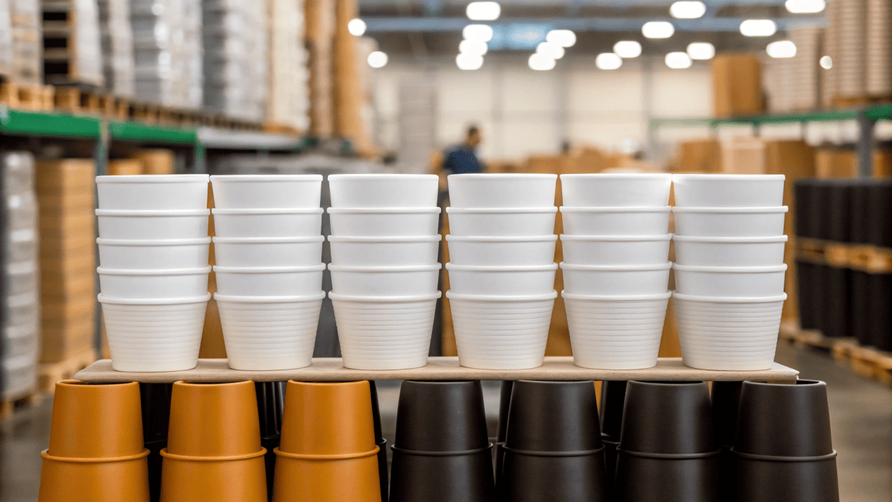 Boxes of custom cups in a warehouse, showing bulk production