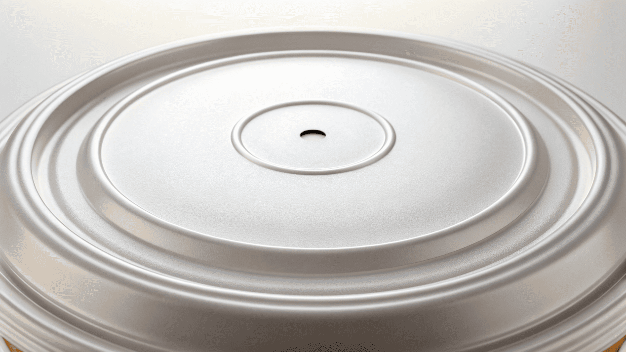 Secure Leak-Proof Soup Container Lid A close-up of a tightly sealed, leak-proof soup container lid with a small vent.