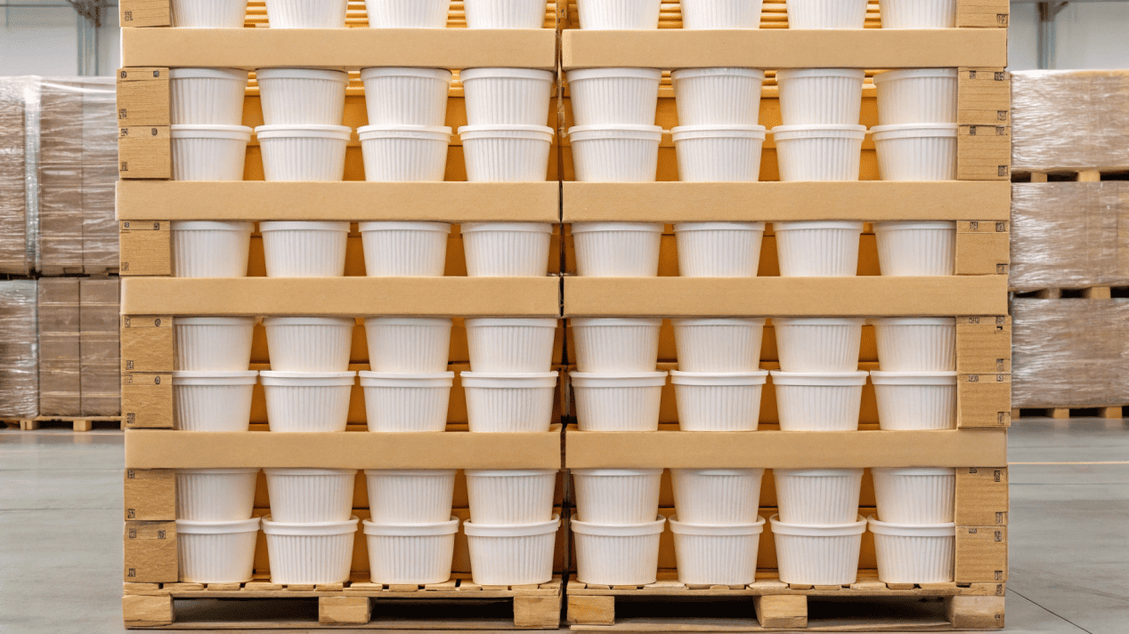 Efficient Distribution and Palletization A perfectly stacked pallet of boxed ice cream cups ready for shipping