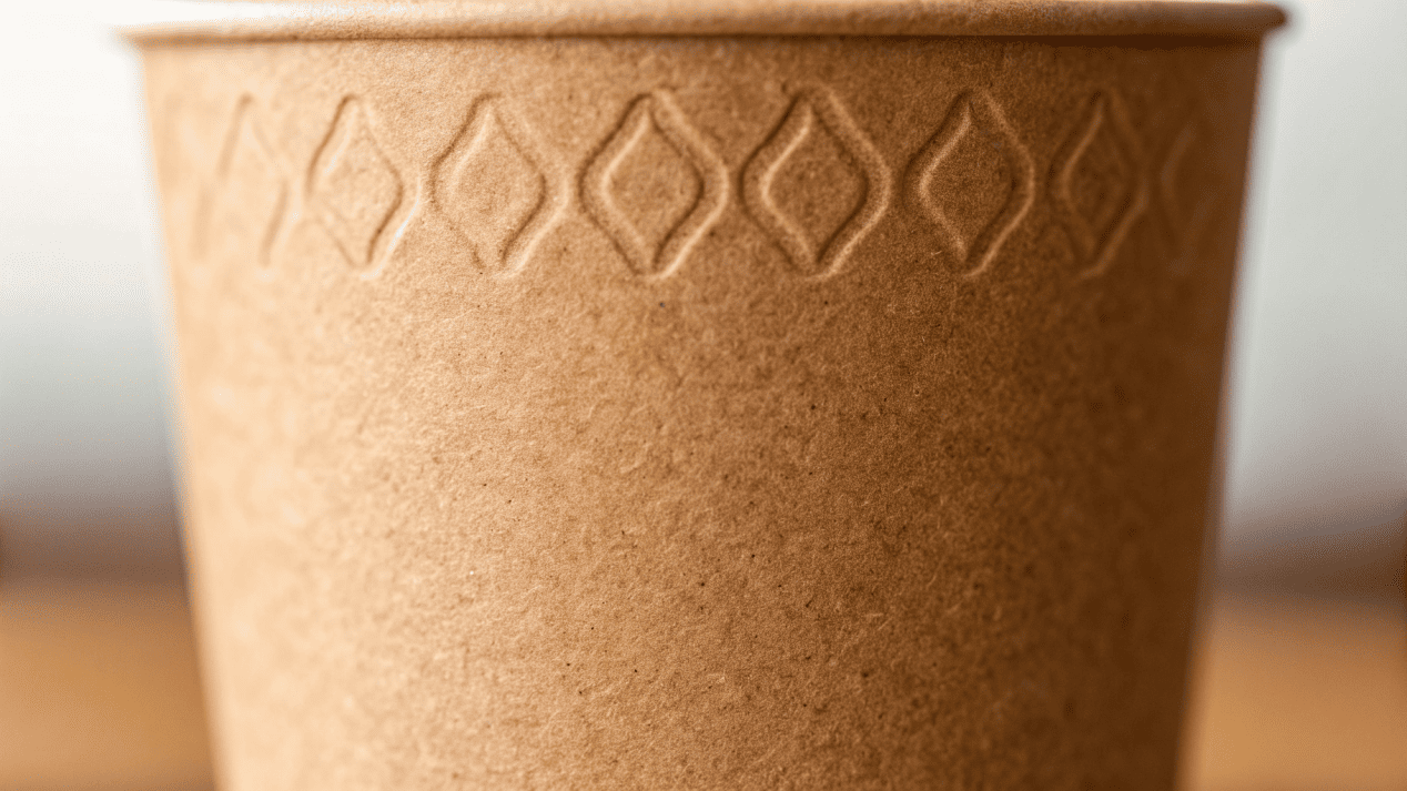 Benefits of Kraft Paper Texture A close-up on the textured surface of a Kraft paper cup.