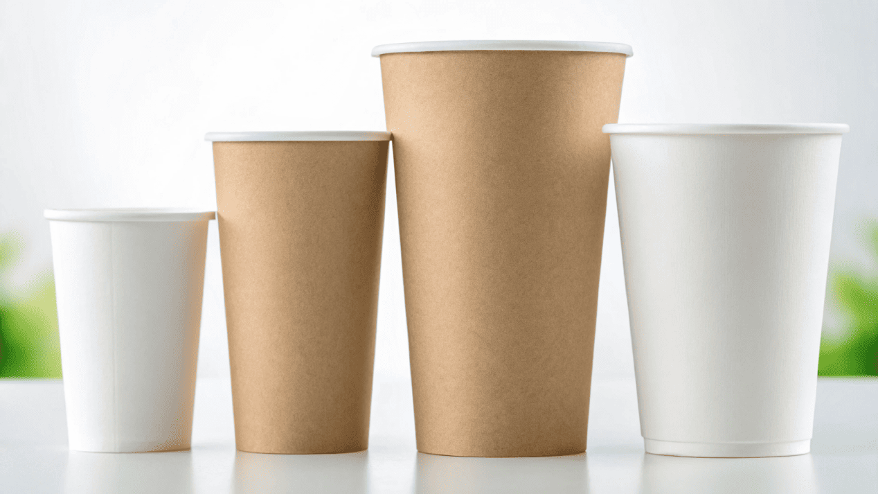 A collection of sustainable paper cups with visible FSC and BPI certification logos.