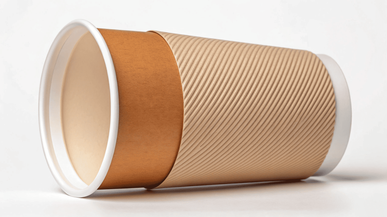 The Hidden Coating Inside a Paper Cup An illustration peeling back the layers of a paper cup to reveal the inner coating.