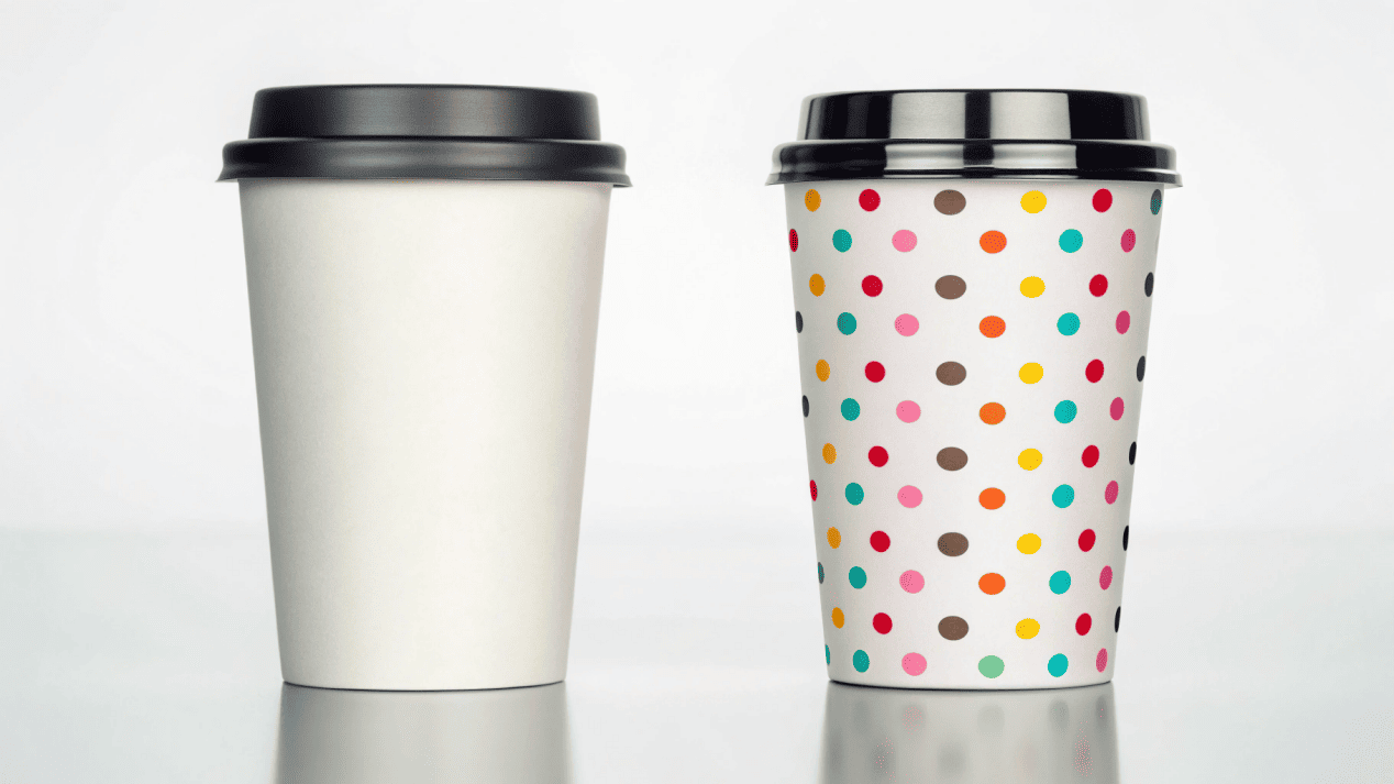 A high-end coffee cup next to a fun, colorful frozen yogurt cup.