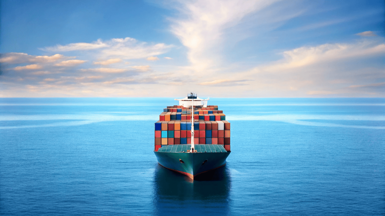 A cargo ship on the ocean, representing the global logistics and supply chain of raw materials