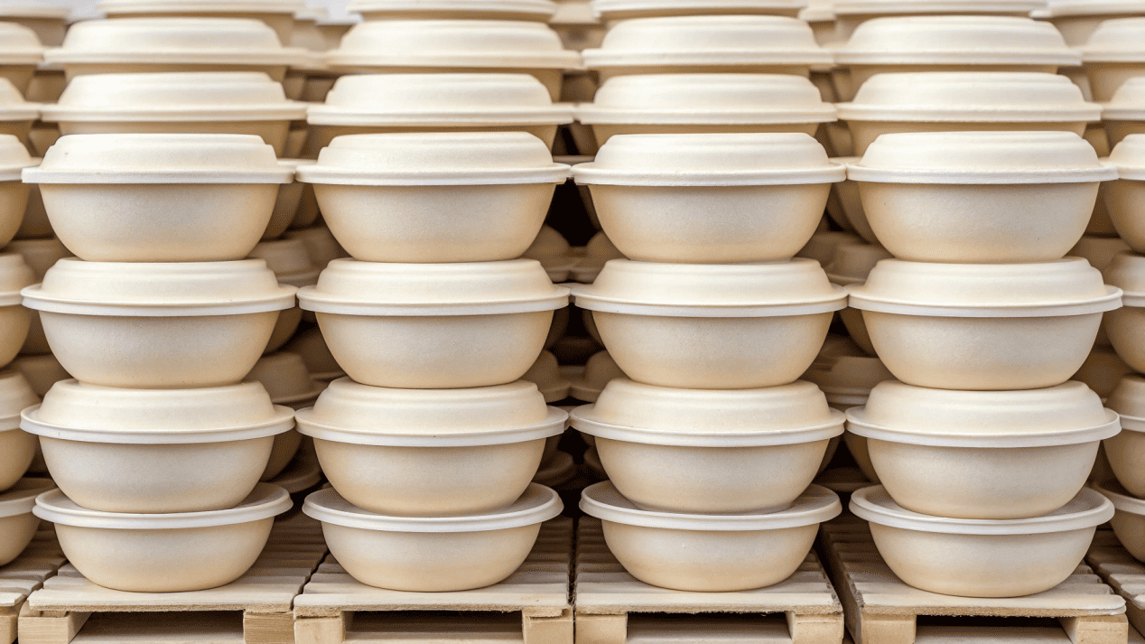 An assortment of high-quality compostable soup bowls and lids ready for wholesale