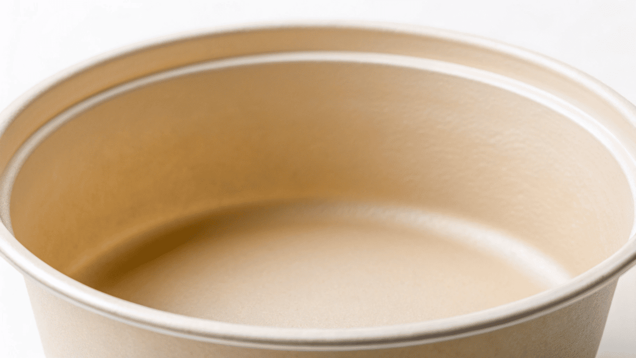 Food-Grade Inner Lining A macro shot showing the smooth, clean, seamless inner lining of a disposable soup bowl.