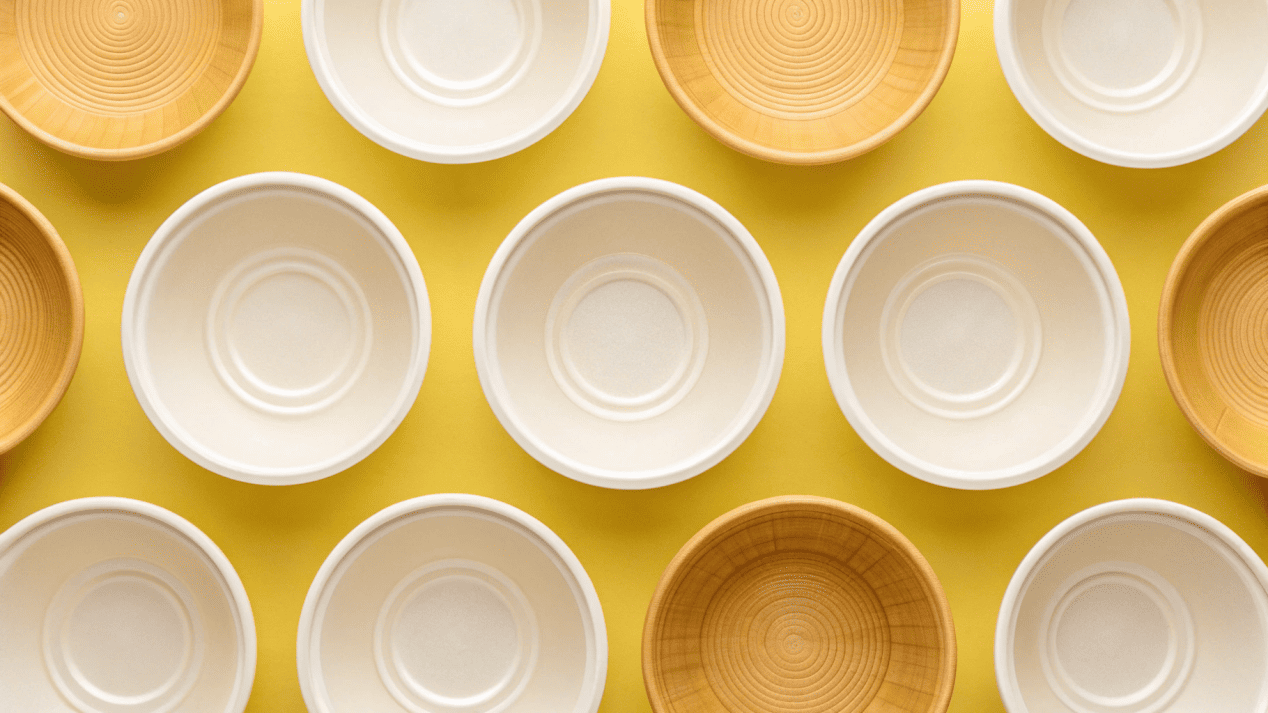 An assortment of disposable bowls made from paper, PLA, plastic, and bamboo.