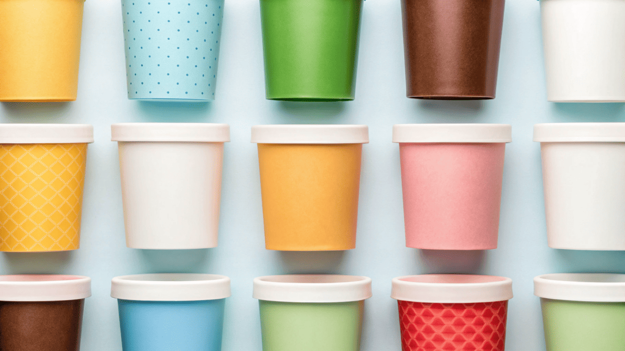 A display of various branded ice cream tubs and pints.