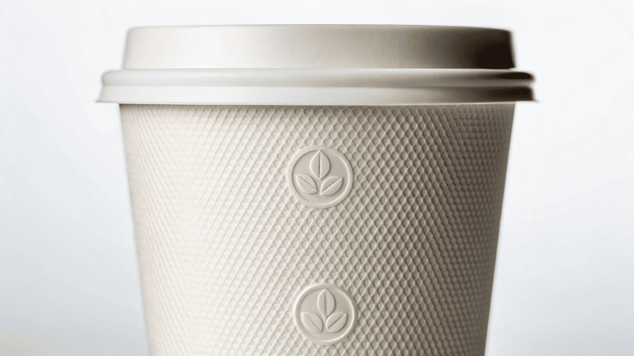 Biodegradable Product Certifications A close-up of a cup showing official certification logos like BPI Certified and TÜV AUSTRIA OK compost.