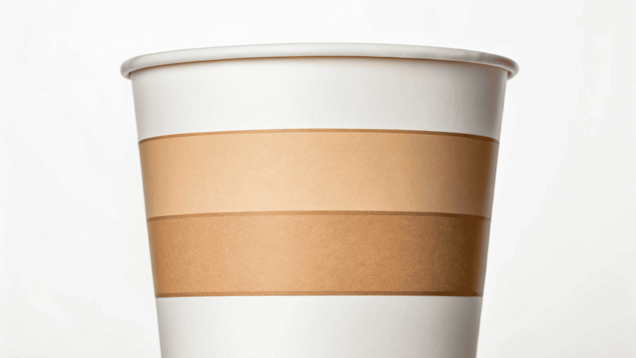 A cross-section diagram showing the layers of a paper cup, including the paperboard and the inner coating.