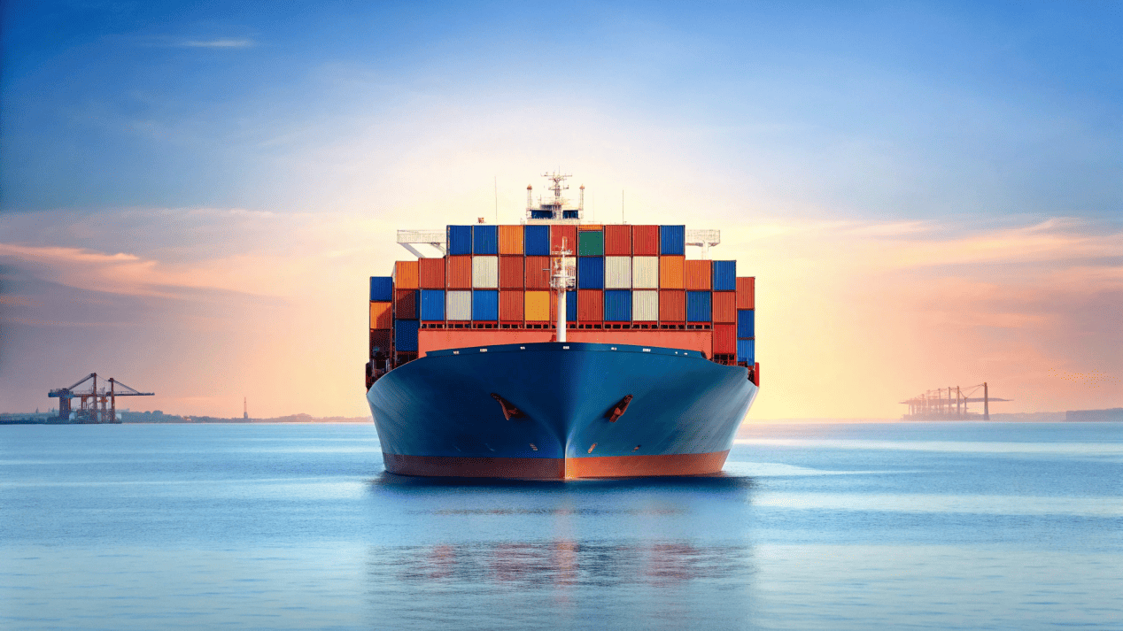 A large cargo ship with containers, representing global logistics and tariffs.