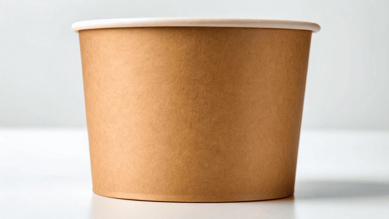 A close-up image showing the sturdy, thick paperboard and interior lining of a high-quality ice cream cup.