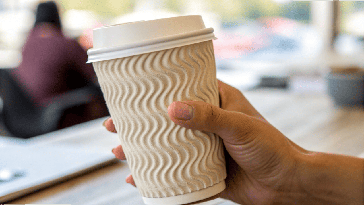 Textured Grip of a Ripple-Wall Cup A close-up shot of a hand comfortably holding a ripple-wall cup, highlighting the texture.