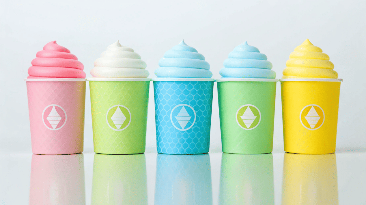 A colorful array of different sized custom-branded ice cream cups.