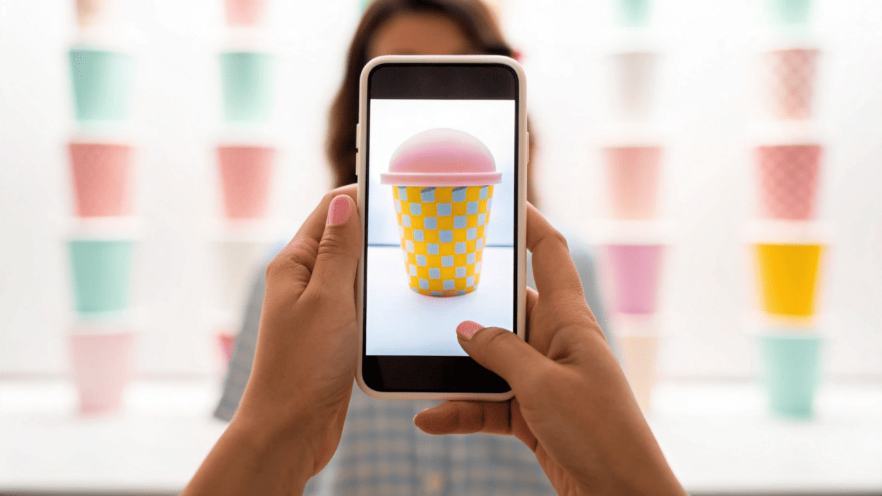 Instagrammable Ice Cream Cup Trends A person taking a photo of their stylish ice cream cup for social media.