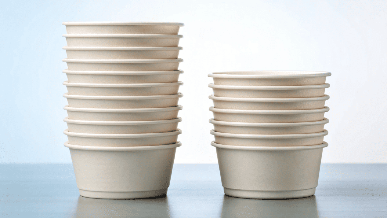 A tall, stable, and compact stack of paper bowls, contrasted with a messy, leaning stack of poorly designed bowls.