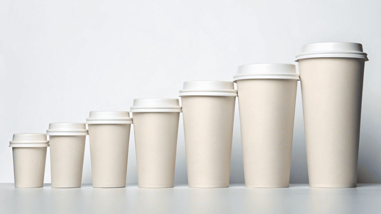 A lineup of different sized paper cups, from 4oz to 16oz, with labels for their common uses.