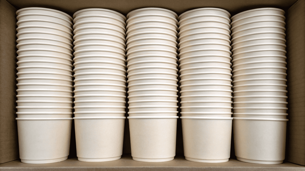 A photo showing soup cups stacked tightly or "nested" inside a shipping box to save space.